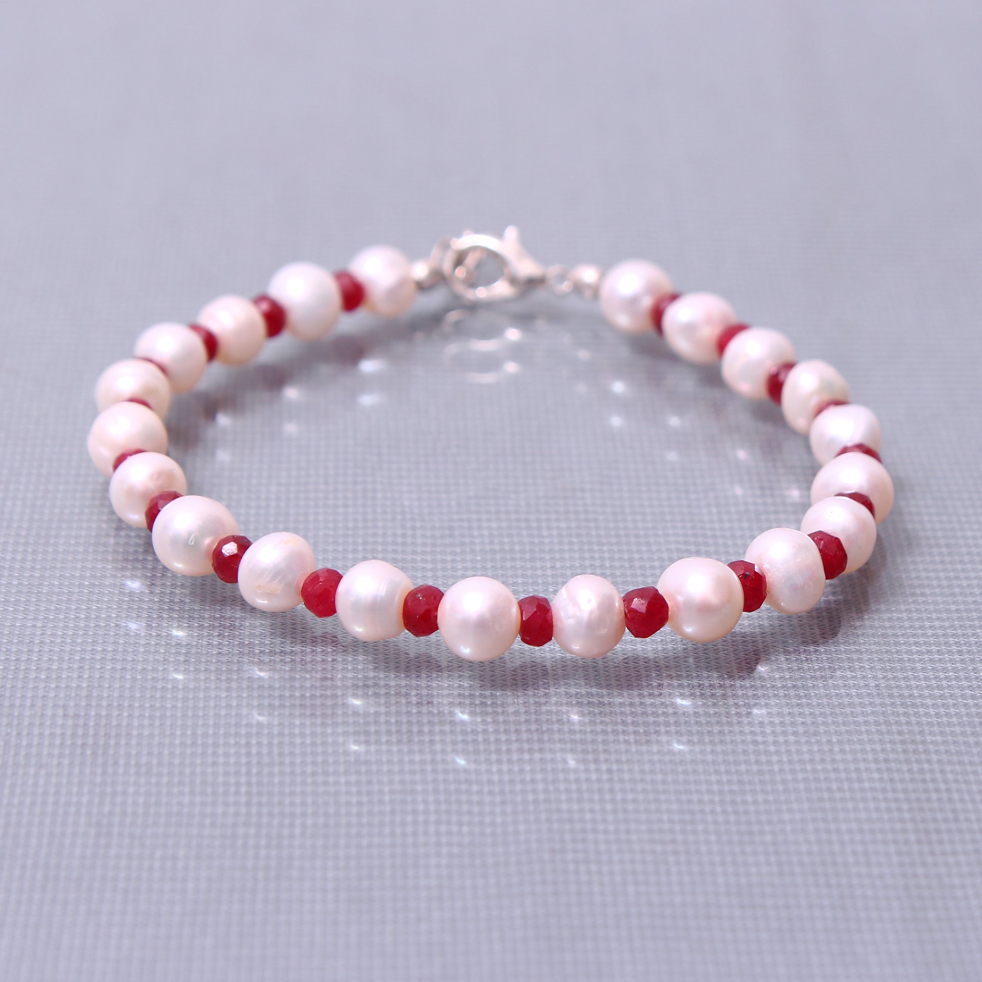 faceted ruby beads with Pearl bracelet