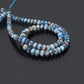 Smooth rondelle Golden Hills Turquoise beads close up