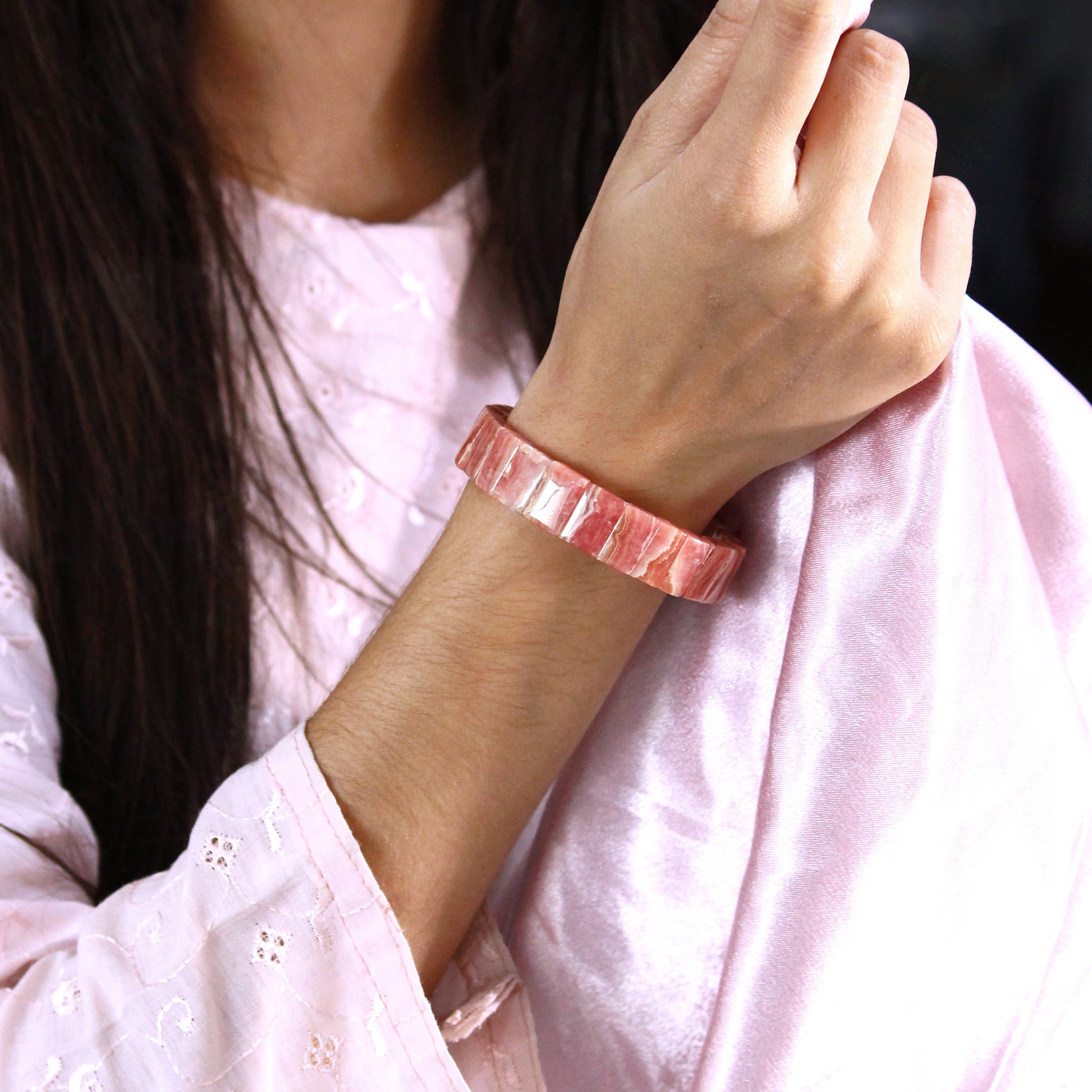 handmade rhodochrosite gemstone stretch bracelet on hand