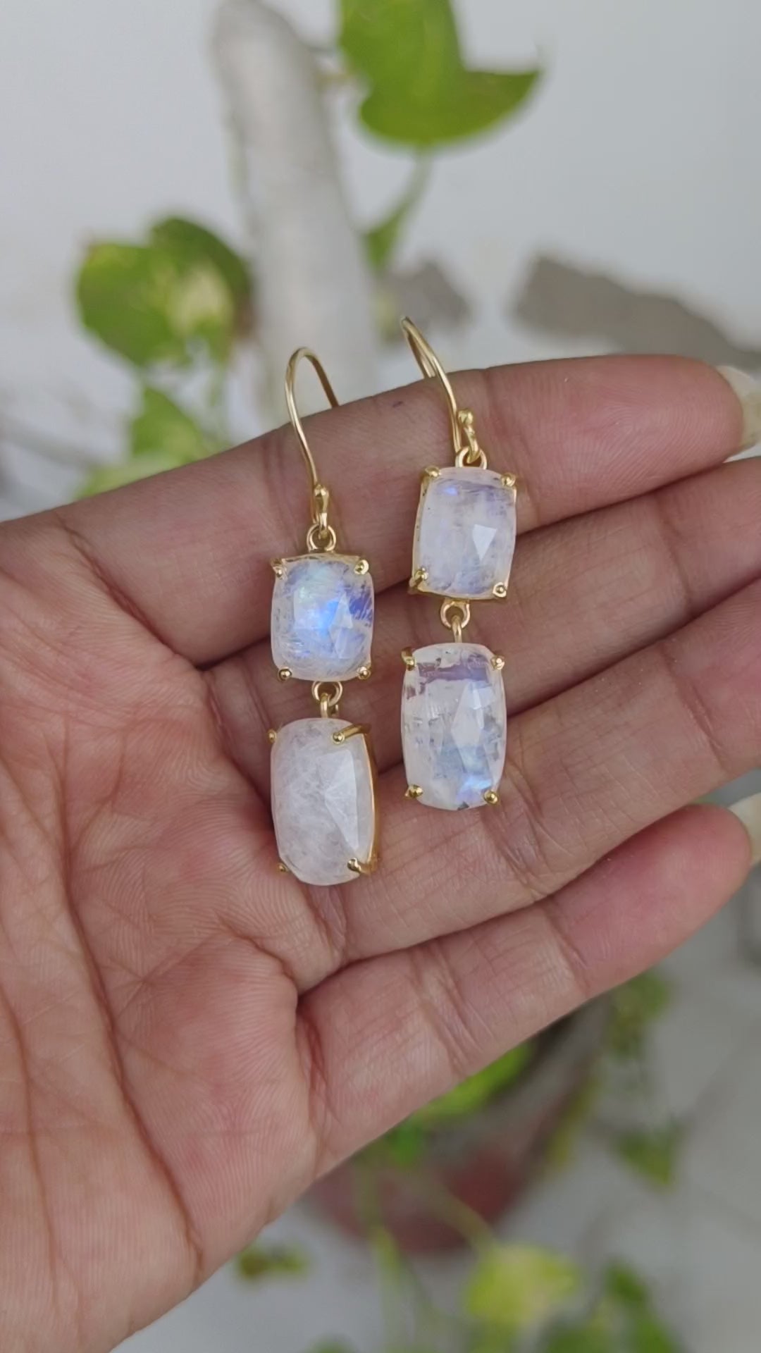 Blue fire rainbow moonstone gold plated sterling silver dangle earrings showing blue flash