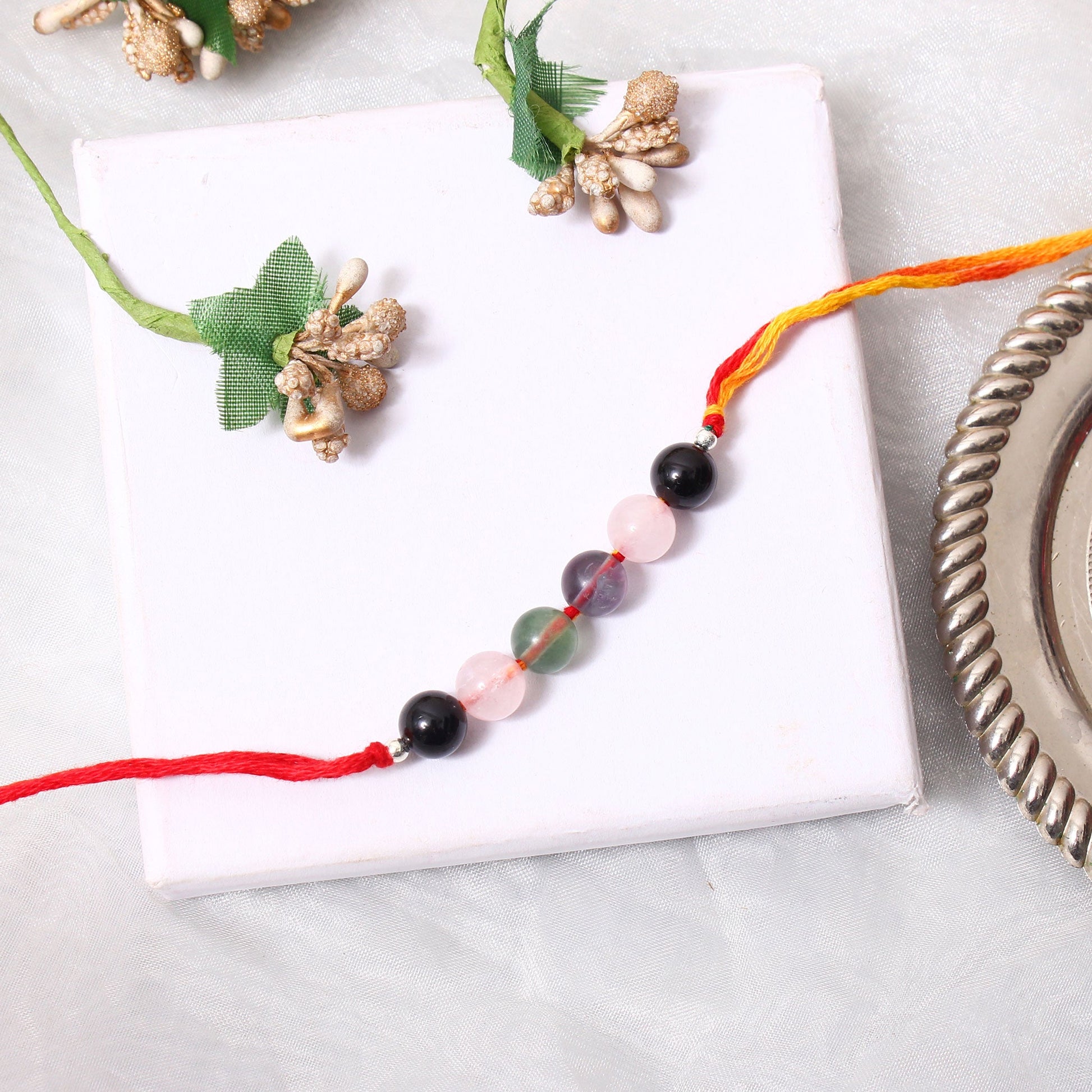 Special Gemstone Rakhi for Brother: Handcrafted with Natural Round Gemstones GemsRush
